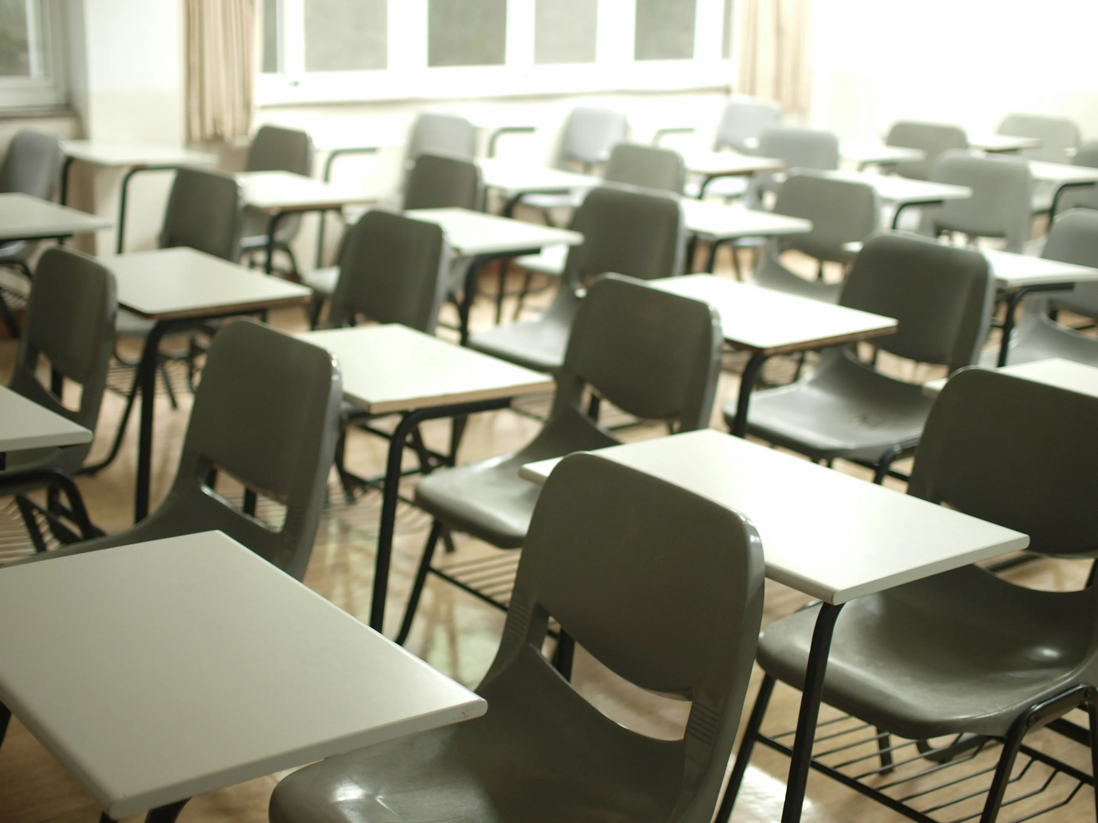 A classroom full of empty desks.